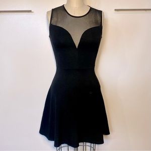 Bebe Women’s Black Plunge Cocktail Dress with Mesh Panel - size XS